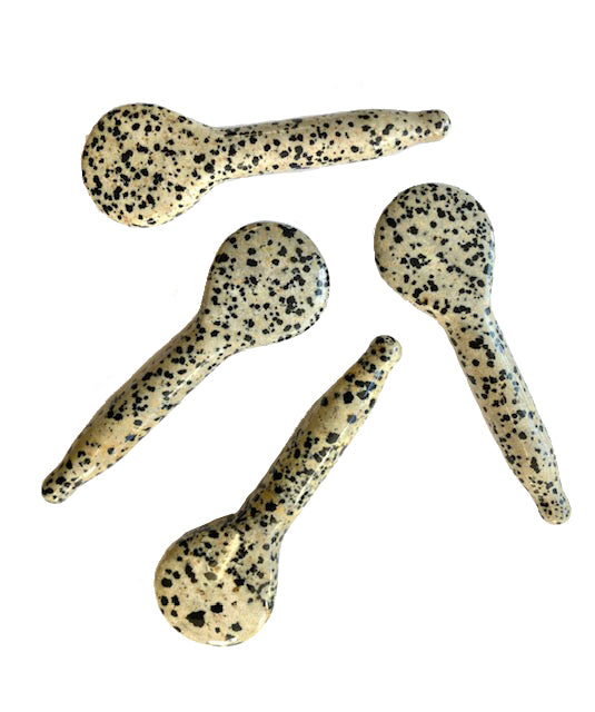 Several Dalmatian stone sculpting spoons showing natural stone variation
