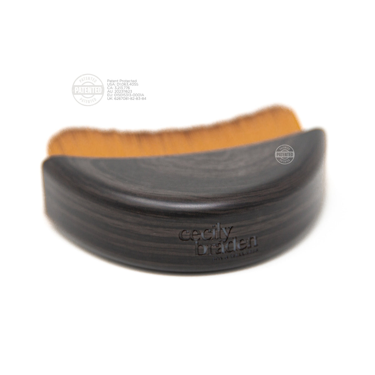 Side view of The Lymphatic Brush Small showing its contoured shape and patented bristle pattern