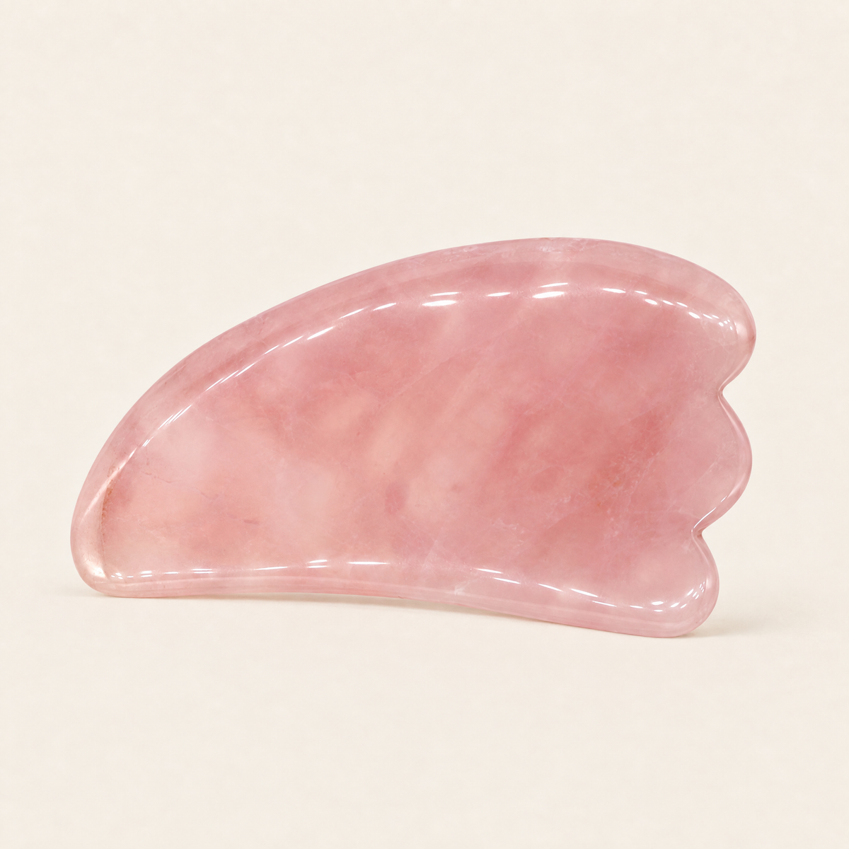 Rose quartz body gua sha tool with wavy edge