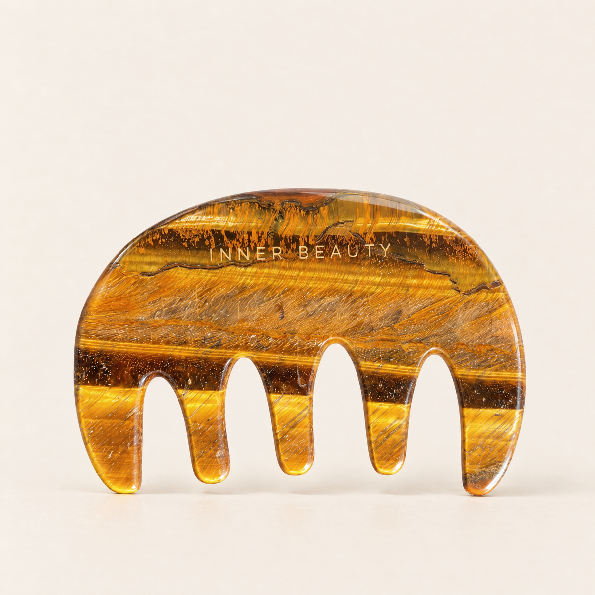 Inner Beauty Shop tiger's eye gua sha comb with wide rounded teeth