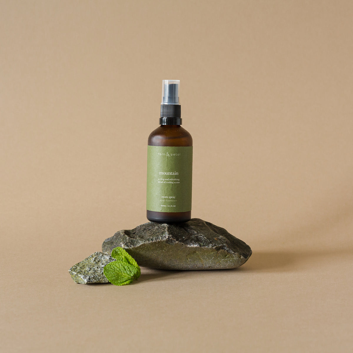 Mountain room spray in a forest-inspired setting